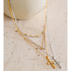 Colgante Claire de cruz con capas