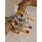 Dije de cruz con margarita